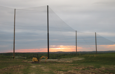 Completed view of golf netting installation